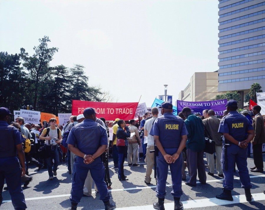 Bruno Serralongue, Street Hawkers and Farmers from Africa and Asia March to demand the Freedom to Trade, Speaker’s Corner, Sandton, Johannesburg, 28.08.02. From the 'Earth Summit' series, 2002. © Air de Paris, Romainville