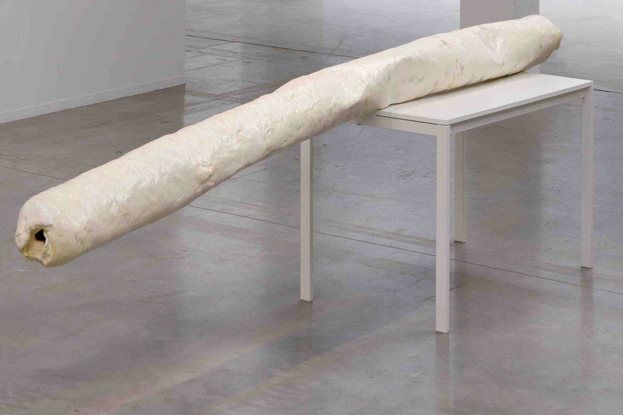 Jean-Charles de Quillacq, Shopping, 2019. Epoxy resin, Tarbender, urine, wood table, 340 x 94 x 70 cm. Ma sys­tème repro­duc­tive at Bétonsalon - Centre d’art et de recher­­­che, Paris, 2019. Photo: Aurélien Mole. Courtesy Marcelle Alix, Paris